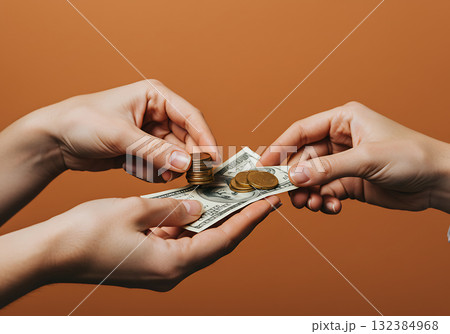 Two people exchanging money with a dollar bill and coins. Close-up of a cash payment transaction. Finance and commerce concept on a brown background 132384968