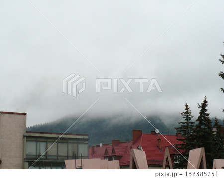 fog over the roofs of buildings in the city fog over the roofs of buildings in the city 132385251