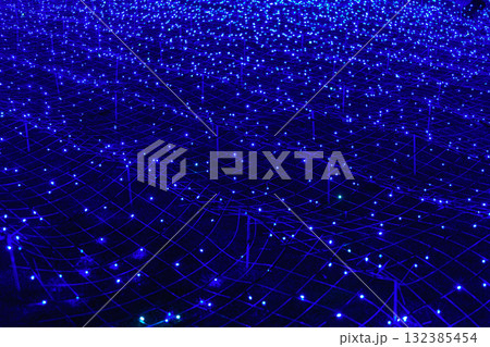 Futuristic background of blue led lights arranged in grid pattern, network, glowing at night Futuristic background of blue led lights arranged in grid pattern, network, glowing at night 132385454