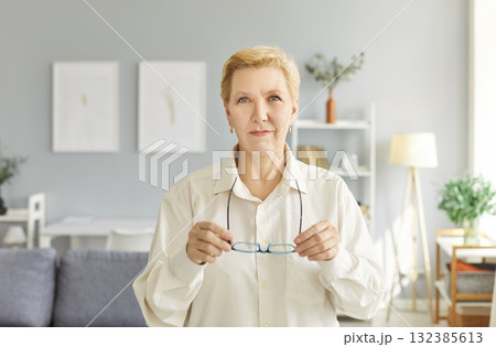 Attractive elderly, beautiful aged mature woman portrait, looking at camera, happy old lady Attractive elderly, beautiful aged mature woman portrait, looking at camera, happy old lady 132385613