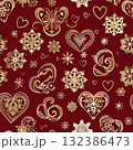 Romantic golden hearts and swirling curls form an ornate seamless pattern on red, ideal for Christmas or Valentine's Day gift wrapping. 132386473