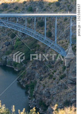 Majestic Steel Bridge Spanning Rugged Canyon Majestic Steel Bridge Spanning Rugged Canyon 132386937