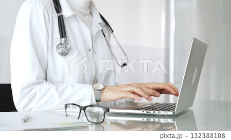 Healthcare professional working on laptop, providing digital medicine consultation and tele health service. Medicine, healthcare and science concept 132388108