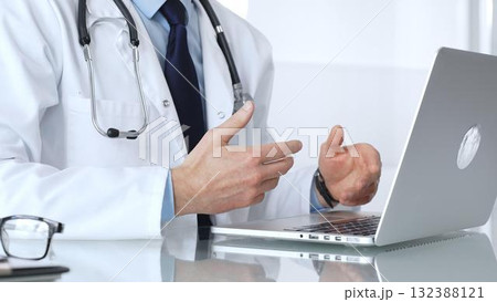 Doctor discussing medical information during an online consultation via teleconference, providing remote healthcare service. Medicine, healthcare and science concept Doctor discussing medical information during an online consultation via teleconference, providing remote healthcare service. Medicine, healthcare and science concept 132388121