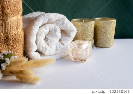 Natural beauty concept with sunlight and delicate spa decor. Horizontal shot. Warm tones 132388168