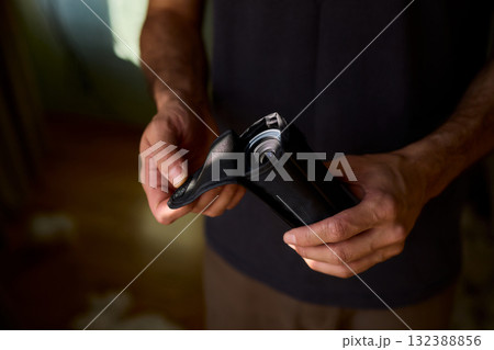 A Person Diligently Using a Telescope for Detailed Observation of the Night Sky and Beyond 132388856