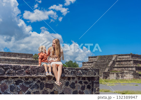 Mother and her son as tourists in front of Teotihuacan pyramids, Mexico, enjoying sightseeing, family travel, and cultural exploration together Mother and her son as tourists in front of Teotihuacan pyramids, Mexico, enjoying sightseeing, family travel, and cultural exploration together 132389947