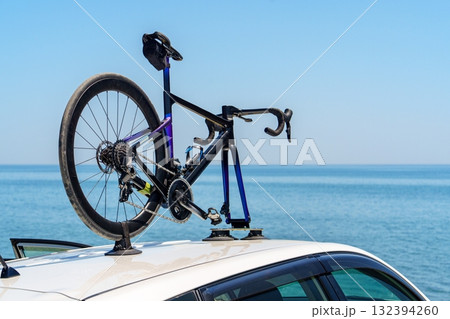Bike Attached to Car Roof Rack with Sea View Freedom, Travel and Adventure Awaits 132394260