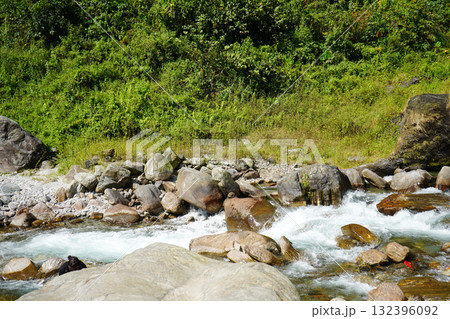 Rushing Mountain Stream and Rocky Riverbank Rushing Mountain Stream and Rocky Riverbank 132396092