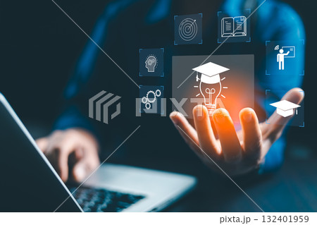 Concept of online education and digital learning is illustrated by hand using laptop, surrounded by icons such diploma, brain, target-symbolizing ideal e-learning platforms on education, development Concept of online education and digital learning is illustrated by hand using laptop, surrounded by icons such diploma, brain, target-symbolizing ideal e-learning platforms on education, development 132401959