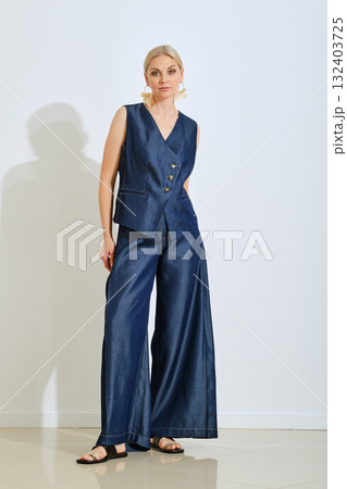 Stylish woman posing in a chic navy outfit...の写真素材 [132403725] - PIXTA