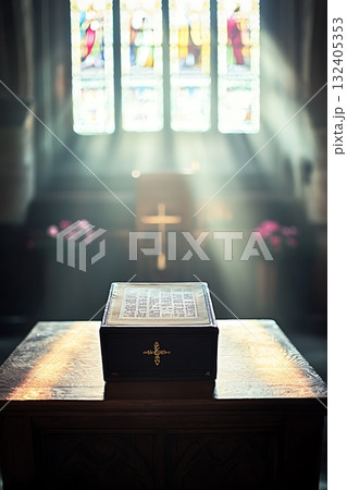 Book is on a table in front of a window Book is on a table in front of a window 132405353