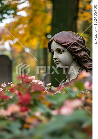 Statue of a woman is sitting in a garden with flowers Statue of a woman is sitting in a garden with flowers 132405400