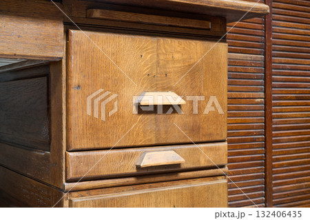 drawer of an old wooden office cabinet drawer of an old wooden office cabinet 132406435