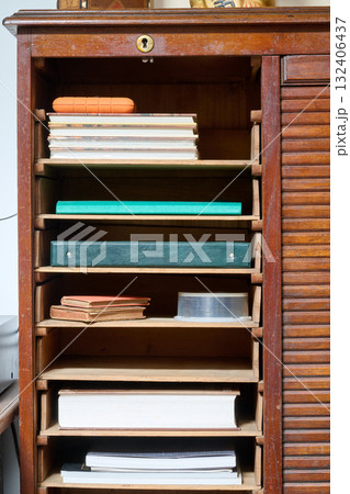 Shelves on antique wooden furniture Shelves on antique wooden furniture 132406437