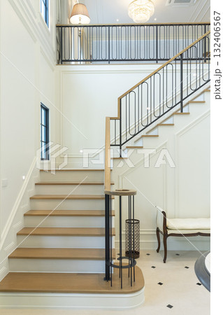 Luxury home interior white walls and a white staircase. 132406567