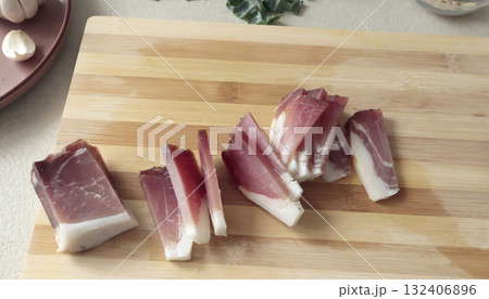 Smoked brisket on wooden board. Farm produce. Healthy eating. Mediterranean diet. Traditional Italian cuisine. 132406896