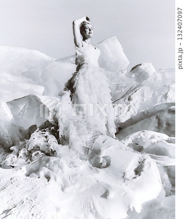 Snow Queen in a wedding dress poses on a mountain of ice and snow, symbolizing cold beauty. Snow Queen in a wedding dress poses on a mountain of ice and snow, symbolizing cold beauty. 132407097