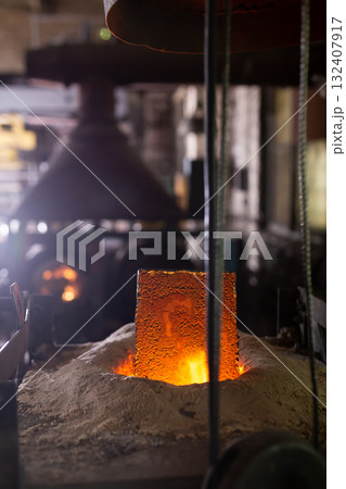 Foundry ferrous metal is melted in an induction furnace of metallurgical plant 132407917