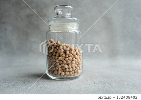 Glass jar with raw chickpeas Glass jar with raw chickpeas 132408402
