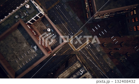 A breathtaking aerial perspective captures the intricate layout of urban buildings as evening shadows stretch across pavement. Sidewalks bustle with activity under warm sunlight. 132408432
