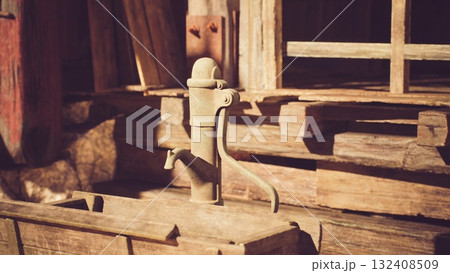 A vintage wooden water pump stands beside a rustic cabin, surrounded by timber walls and a warm sunshine, evoking a nostalgic countryside atmosphere. 132408509