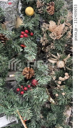 Christmas wreath with pinecones, berries, and ornaments for festive decoration background 132409053