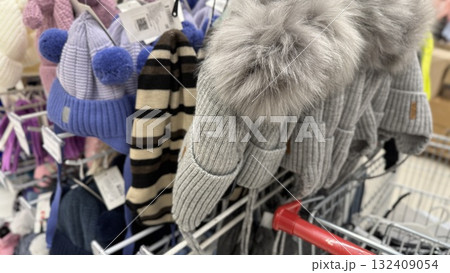 Winter hats on display in store, showcasing variety of styles, fabrics, and textures 132409054