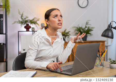 Young businesswoman sees laptop hang presses keys but computer fails to respond frustrated halt hard Young businesswoman sees laptop hang presses keys but computer fails to respond frustrated halt hard 132409130