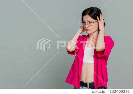 Woman sighs with disappointment covering face expressing sadness after failure or bad news reaction 132409233