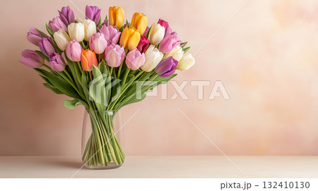 Colorful tulips in glass vase on yellow background with minimal style Colorful tulips in glass vase on yellow background with minimal style 132410130