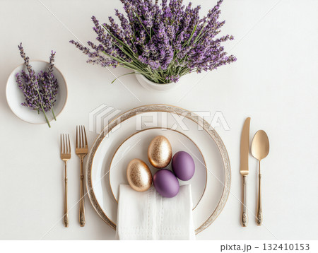 Luxury Happy Easter. Elegant top view, layout, minimalist style, Easter decorated table with golden eggs and lavender bouquet 132410153
