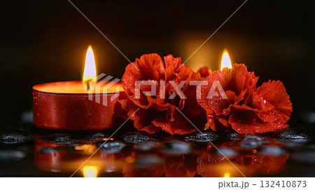 Beautiful red roses and candle on table against black background. Funeral symbol. Burning candle placed between two white roses dark surface, symbolizing remembrance. Beautiful red roses and candle on table against black background. Funeral symbol. Burning candle placed between two white roses dark surface, symbolizing remembrance. 132410873