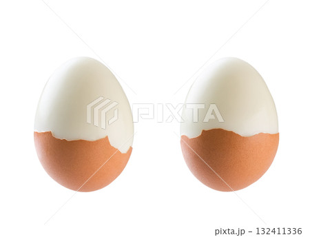 Peeled boiled egg with eggshell isolated on a white background. two boiled brown eggs isolated . 132411336