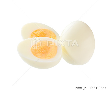 Hard boiled chicken eggs and half of egg with yellow yolk  isolated on a white background. 132411343