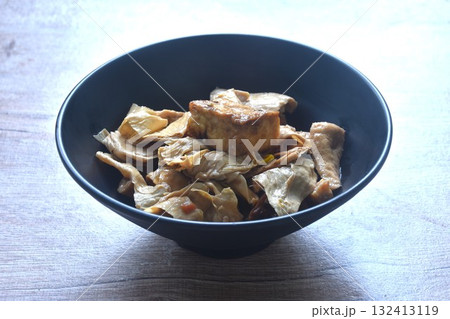 fried slice yellow tofu and gypsum with celery in soy sauce vegetarian food on bowl 132413119