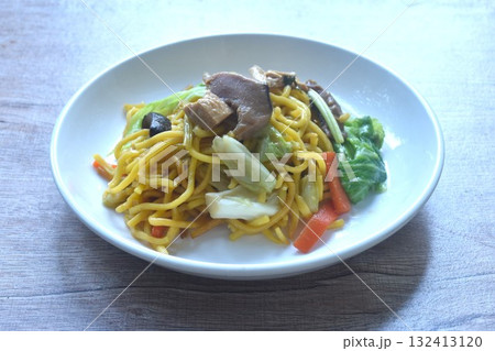 fried yakisoba noodles and cabbage with mushroom vegetarian food on plate fried yakisoba noodles and cabbage with mushroom vegetarian food on plate 132413120