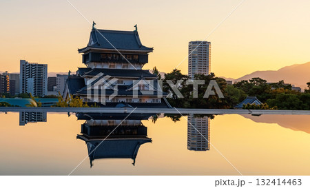 Kokura Castle with reflection on pond at sunset, Kitakyushu Kokura Castle with reflection on pond at sunset, Kitakyushu 132414463