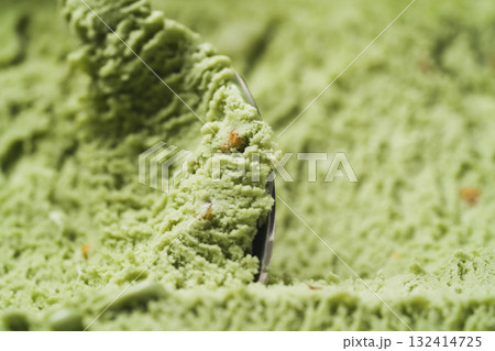 Close-up pistachio ice cream background scooping Close-up pistachio ice cream background scooping 132414725