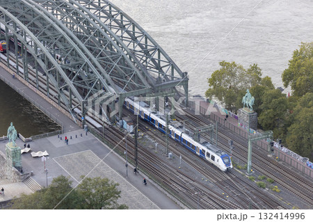Hohenzollern Bridge in the evening and moving train Hohenzollern Bridge in the evening and moving train 132414996