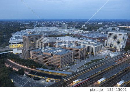 Evening view of Cologne Koelnmesse and railway tracks Evening view of Cologne Koelnmesse and railway tracks 132415001