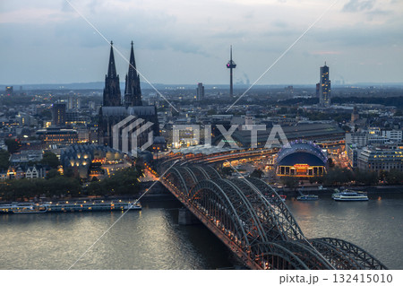 Evening view of Cologne Cathedral and Hohenzollern Bridge in the sunset 132415010