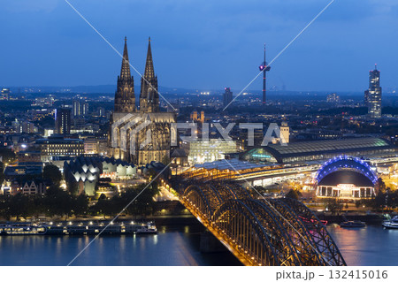 Evening view of Cologne Cathedral and Hohenzollern Bridge in the sunset Evening view of Cologne Cathedral and Hohenzollern Bridge in the sunset 132415016