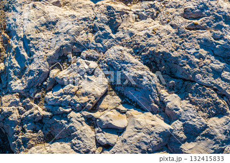Large rocks in the artificial harbor bay near the village of Roda on the island of Corfu Large rocks in the artificial harbor bay near the village of Roda on the island of Corfu 132415833