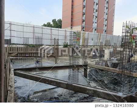 Urban construction site building foundation concrete slab steel rebar formwork crane free morning light progress Urban construction site building foundation concrete slab steel rebar formwork crane free morning light progress 132418380