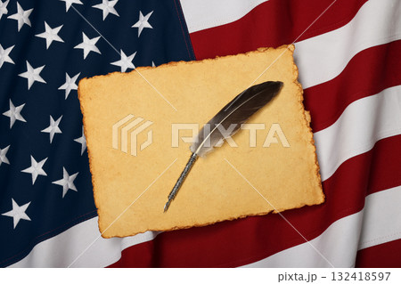 Vintage paper and quill on US American flag 132418597