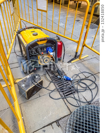 Portable Generator with Yellow Frame at Construction Site 132418850