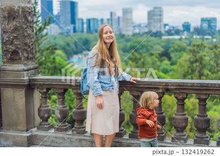 Mother with her young son near Chapultepec Castle in Mexico City, enjoying a cultural family trip. Parenthood, love, heritage sightseeing, and family bonding travel concept Mother with her young son near Chapultepec Castle in Mexico City, enjoying a cultural family trip. Parenthood, love, heritage sightseeing, and family bonding travel concept 132419262