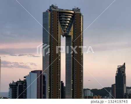 contemporary architectural piece showcasing twin columns and triangular core design elements contemporary architectural piece showcasing twin columns and triangular core design elements 132419743