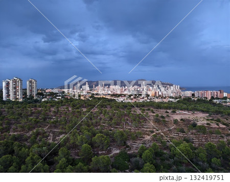 dramatic sky above city, stormy cityscape with looming thunderhead and dramatic atmospheric dramatic sky above city, stormy cityscape with looming thunderhead and dramatic atmospheric 132419751